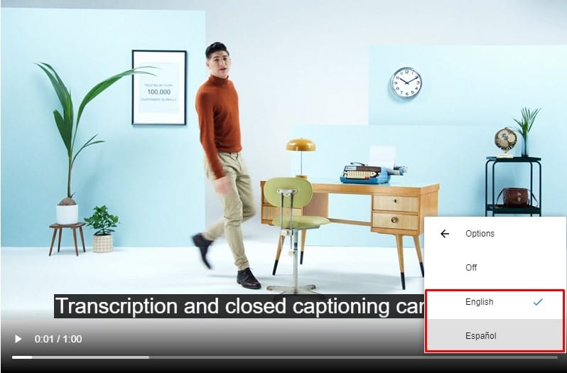 Video Screen With Man In A Bright Office, With Captions Underneath Saying “Transcription And Closed Captioning” And The Language Options Off, English, Or Español