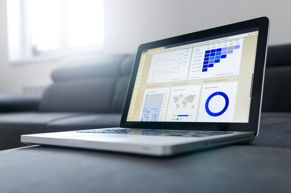 Open laptop on a flat surface depicting various analytical data